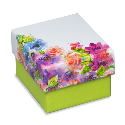 Geschenkverpackung mit fröhlichem Blumenmuster auf dem Deckel